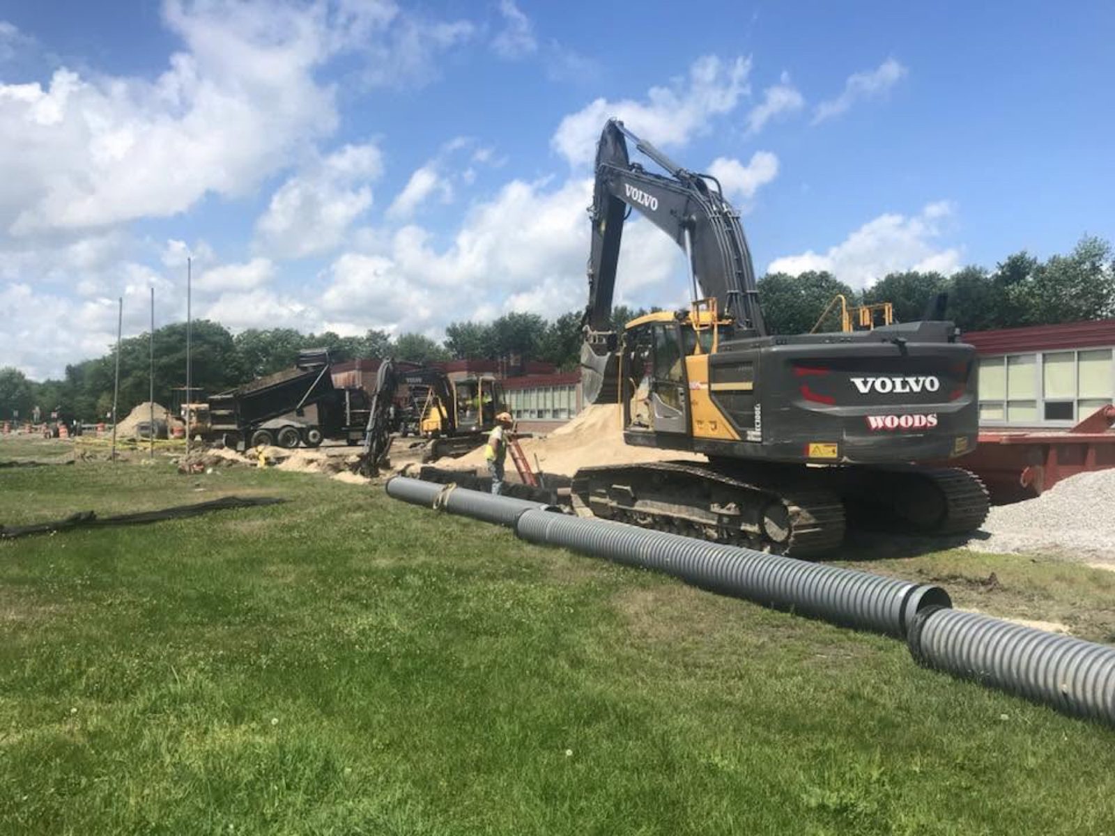 Athletic Fields: Woods crew and equipment on the job