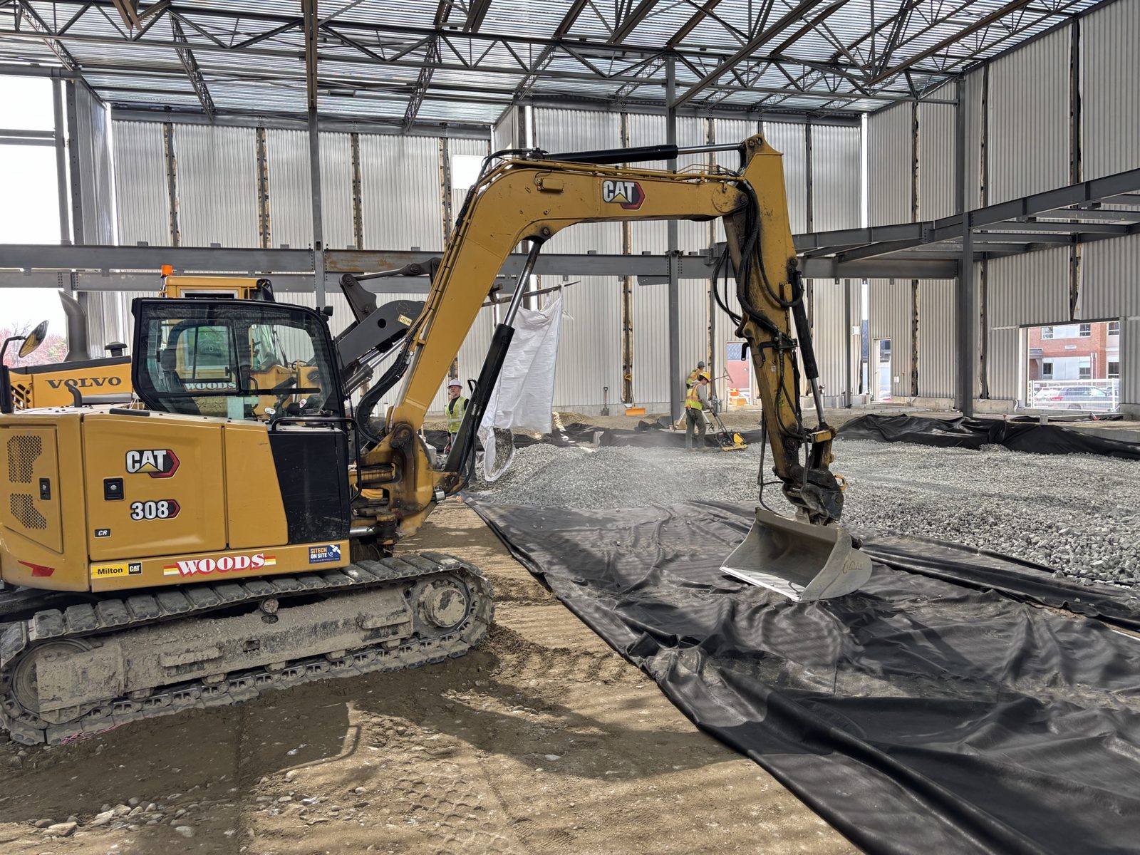 Interior Excavation & Fine Grade: Woods crew and equipment on the job