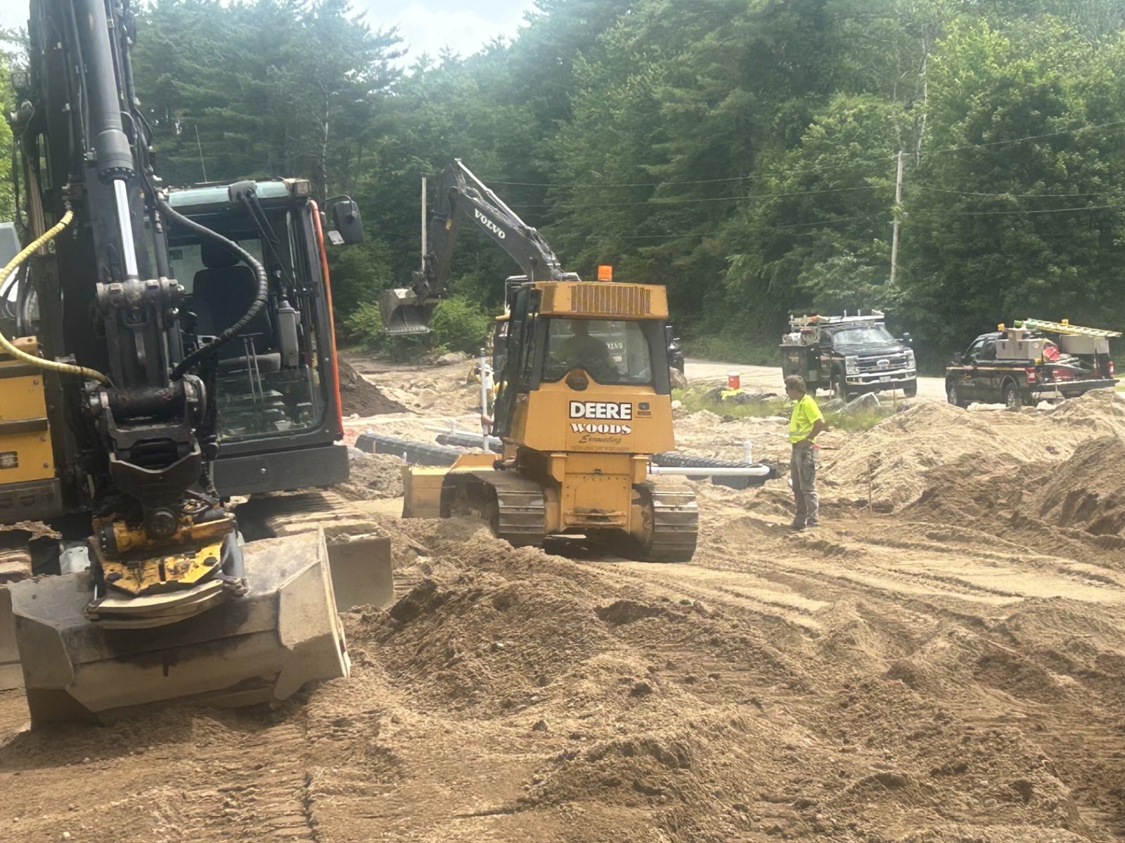Sanitary Sewer: Woods crew and equipment on the job