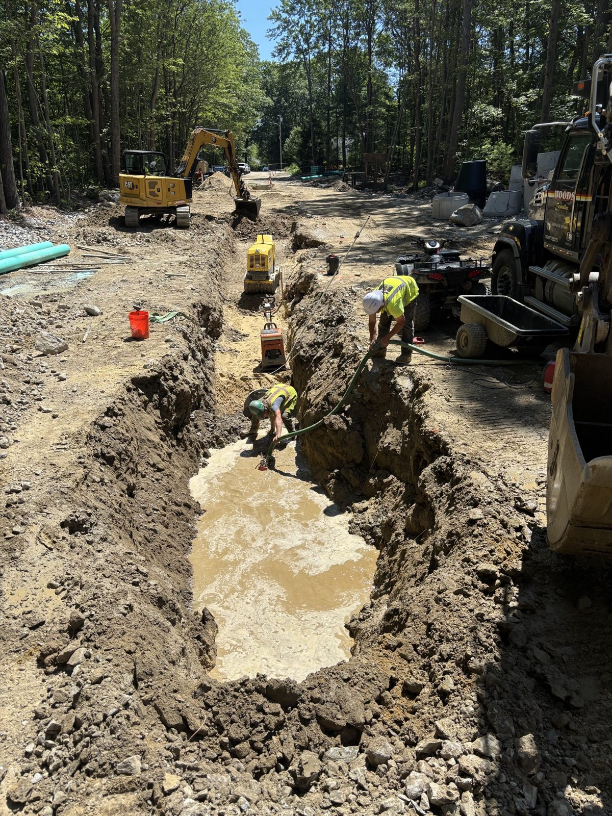 Sanitary Sewer: Woods crew and equipment on the job