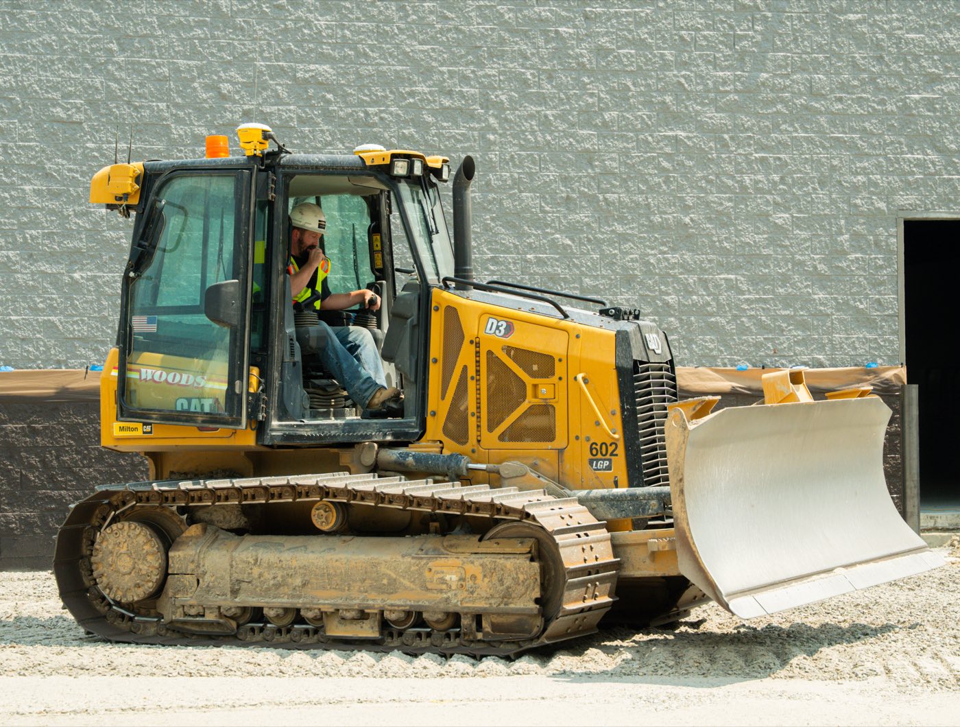 A Woods operator in the cab of a dozer
