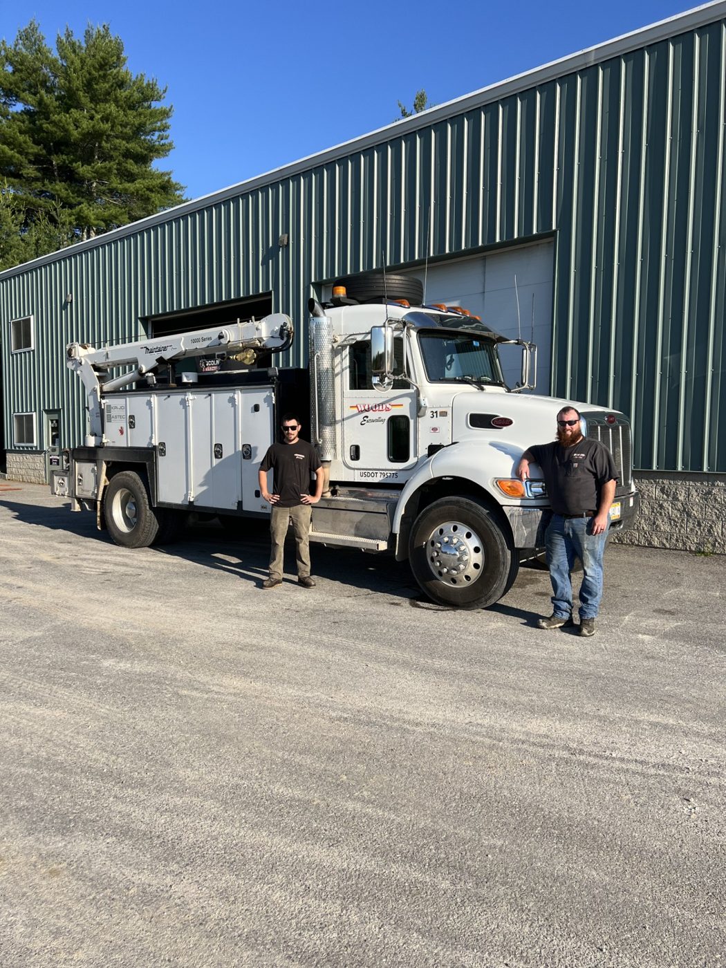 Rob and Will with the Woods service truck outside the shop in Gorham